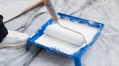 contractor painting house wall